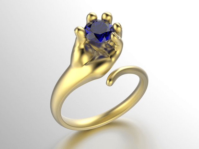 Golden Ring Hand holding Stone
