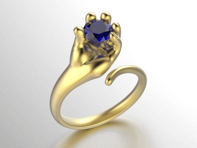 Golden Ring Hand holding Stone